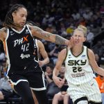 Chicago Sky guard Courtney Vandersloot (22) gets hit on the face by Phoenix Mercury center Brittney Griner during the second half of Game 2 of basketball's WNBA Finals, Wednesday, Oct. 13, 2021, in Phoenix. The Mercury won 91-86 in overtime. (AP Photo/Rick Scuteri)