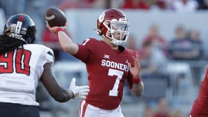 Oklahoma quarterback Spencer Rattler (7) passes during the fourth quarter of an NCAA college footba...