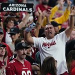 Arizona Cardinals fans cheer during an NFL football game against the Houston Texans, Sunday, Oct. 24, 2021, in Glendale, Ariz. The Cardinals won 31-5. (AP Photo/Ross D. Franklin)