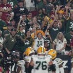 Green Bay Packers fans cheer after a touchdown during the second half of an NFL football game against the Arizona Cardinals, Thursday, Oct. 28, 2021, in Glendale, Ariz. (AP Photo/Ross D. Franklin)