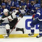 Arizona Coyotes right wing Christian Fischer (36) beats Tampa Bay Lightning defenseman Victor Hedman (77) to a loose puck during the first period of an NHL hockey game Thursday, Oct. 28, 2021, in Tampa, Fla. (AP Photo/Chris O'Meara)
