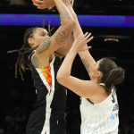 Phoenix Mercury center Brittney Griner (42) shoots over Chicago Sky center Stefanie Dolson during the first half of Game 2 of basketball's WNBA Finals, Wednesday, Oct. 13, 2021, in Phoenix. (AP Photo/Rick Scuteri)