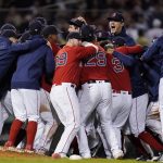 The Boston Red Sox celebrate after they defeated the New York Yankees 6-2 in an American League Wild Card playoff baseball game at Fenway Park, Tuesday, Oct. 5, 2021, in Boston. (AP Photo/Charles Krupa)