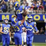 Los Angeles Rams wide receiver Van Jefferson (12) celebrates his touchdown catch with offensive guard Austin Corbett (63) during the first half in an NFL football game against the Arizona Cardinals Sunday, Oct. 3, 2021, in Inglewood, Calif. (AP Photo/Jae C. Hong)
