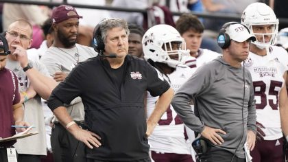 Mississippi State head coach Mike Leach, center left, watches from the sideline in the second half ...