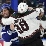 Tampa Bay Lightning left wing Pat Maroon (14) and Arizona Coyotes' Liam O'Brien fight during the first period of an NHL hockey game Thursday, Oct. 28, 2021, in Tampa, Fla. (AP Photo/Chris O'Meara)