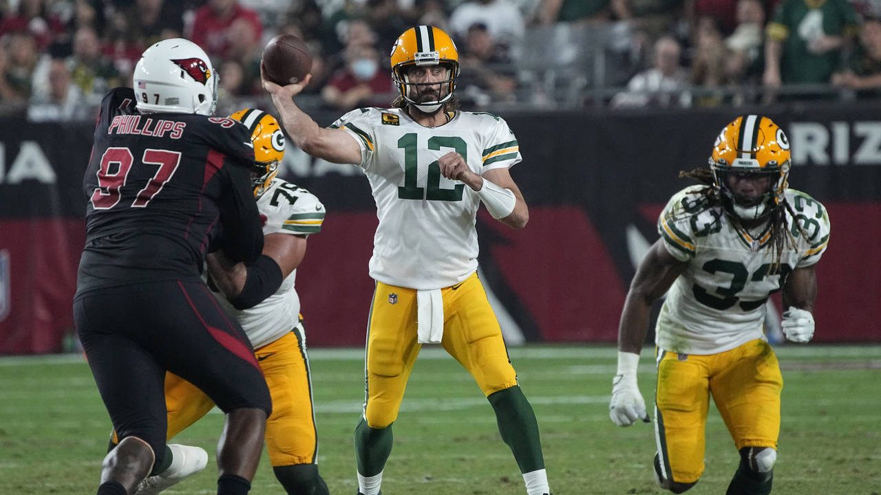 Green Bay Packers quarterback Aaron Rodgers (12) throws against the Arizona Cardinals during the fi...
