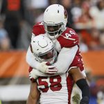 Arizona Cardinals middle linebacker Jordan Hicks (58) celebrates a sack with linebacker Markus Golden (44) during the second half of an NFL football game against the Cleveland Browns, Sunday, Oct. 17, 2021, in Cleveland. (AP Photo/Ron Schwane)