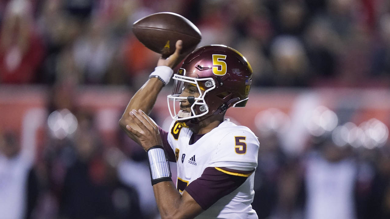Arizona State quarterback Jayden Daniels throws a pass during the first half of the team's NCAA col...