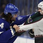 Tampa Bay Lightning left wing Pat Maroon (14) and Arizona Coyotes left wing Lawson Crouse (67) fight during the first period of an NHL hockey game Thursday, Oct. 28, 2021, in Tampa, Fla. (AP Photo/Chris O'Meara)