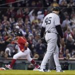 New York Yankees starting pitcher Gerrit Cole (45) reacts as Boston Red Sox's Kyle Schwarber rounds third base after hitting a solo homer in the third inning of an American League Wild Card playoff baseball game at Fenway Park, Tuesday, Oct. 5, 2021, in Boston. (AP Photo/Charles Krupa)