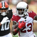 Arizona Cardinals cornerback Robert Alford (23) returns an interception trailed by Cleveland Browns wide receiver Anthony Schwartz (10) during the first half of an NFL football game, Sunday, Oct. 17, 2021, in Cleveland. (AP Photo/David Richard)