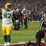 Green Bay Packers nose tackle Kenny Clark (97) celebrates after a turnover against the Arizona Cardinals during the second half of an NFL football game, Thursday, Oct. 28, 2021, in Glendale, Ariz. The Packers won 24-21. (AP Photo/Rick Scuteri)