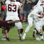 Stanford quarterback Tanner McKee, right, eludes Arizona State defensive back DeAndre Pierce (2) during the second half of an NCAA college football game Friday, Oct. 8, 2021, in Tempe, Ariz. Arizona State defeated Stanford 28-10. (AP Photo/Ross D. Franklin)