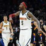 Denver Nuggets forward Will Barton (5) cheers after a basket against the Phoenix Suns during the second half of an NBA basketball game, Wednesday, Oct. 20, 2021, in Phoenix. The Nuggets won 110-98. (AP Photo/Matt York)