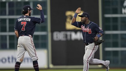 Atlanta Braves center fielder Guillermo Heredia and shortstop Dansby Swanson celebrates their win a...
