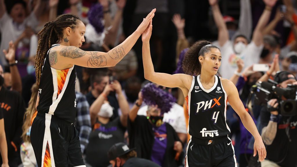 Brittney Griner #42 and Skylar Diggins-Smith #4 of the Phoenix Mercury celebrate after defeating th...