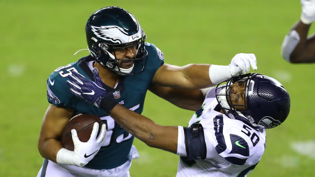 Richard Rodgers #85 of the Philadelphia Eagles is tackled by K.J. Wright #50 of the Seattle Seahawk...
