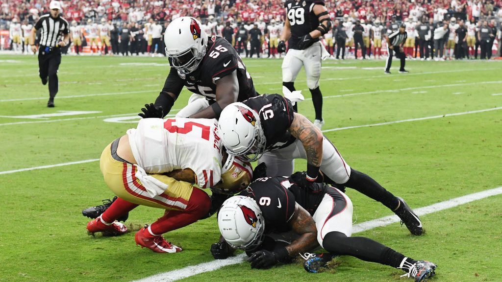 Trey Lance #5 of the San Francisco 49ers is stopped at the 1-yard line on fourth down against the A...