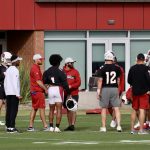 Members of the Arizona Cardinals offense chat during practice Wednesday, Nov. 17, 2021, in Tempe. (Tyler Drake/Arizona Sports)