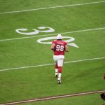 Arizona Cardinals defensive tackle Corey Peters running onto the field before taking on Carolina 11/14/21 (Arizona Sports: Jeremy Schnell)
