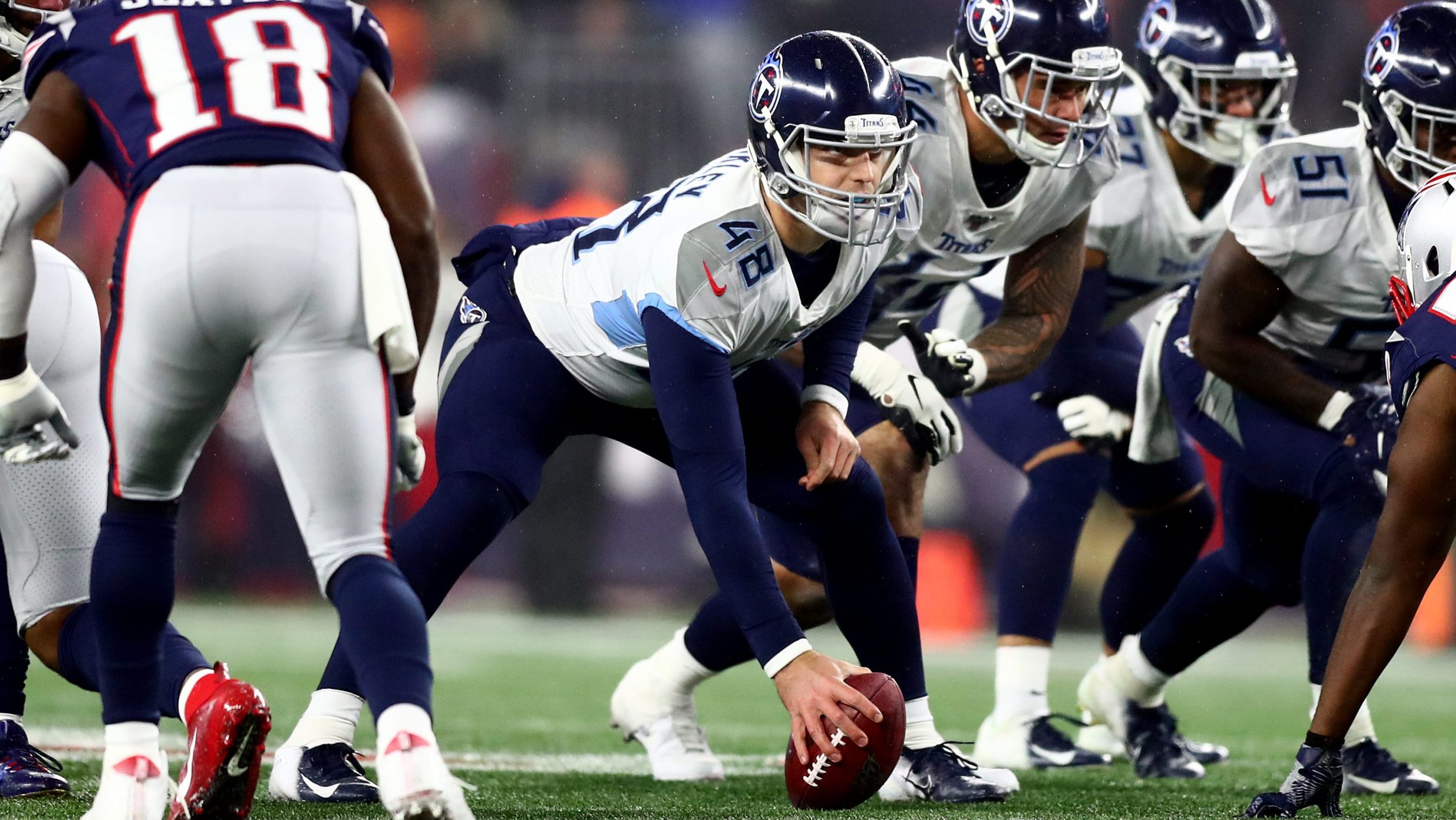 Beau Brinkley #48 of the Tennessee Titans prepares to snap the ball in the AFC Wild Card Playoff ga...