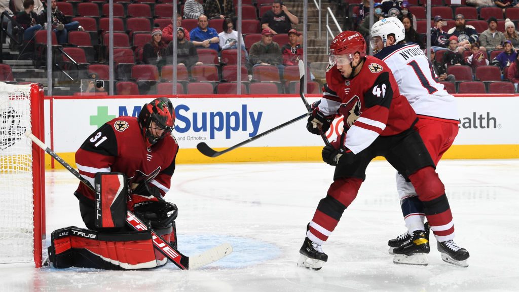 Scott Wedgewood #31 of the Arizona Coyotes makes the save on a shot by Gustav Nyquist #14 of the Co...