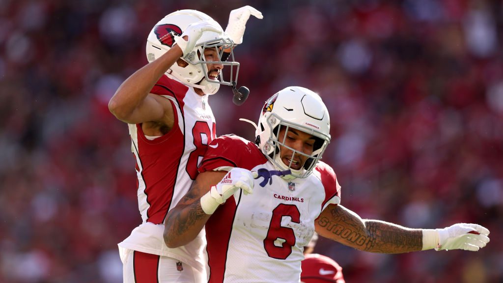 James Conner #6 of the Arizona Cardinals celebrates with Antoine Wesley #85 after running for a tou...