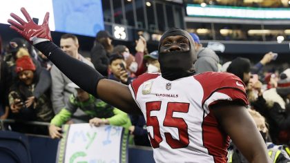 Chandler Jones #55 of the Arizona Cardinals celebrates as he walks off the field after defeating th...