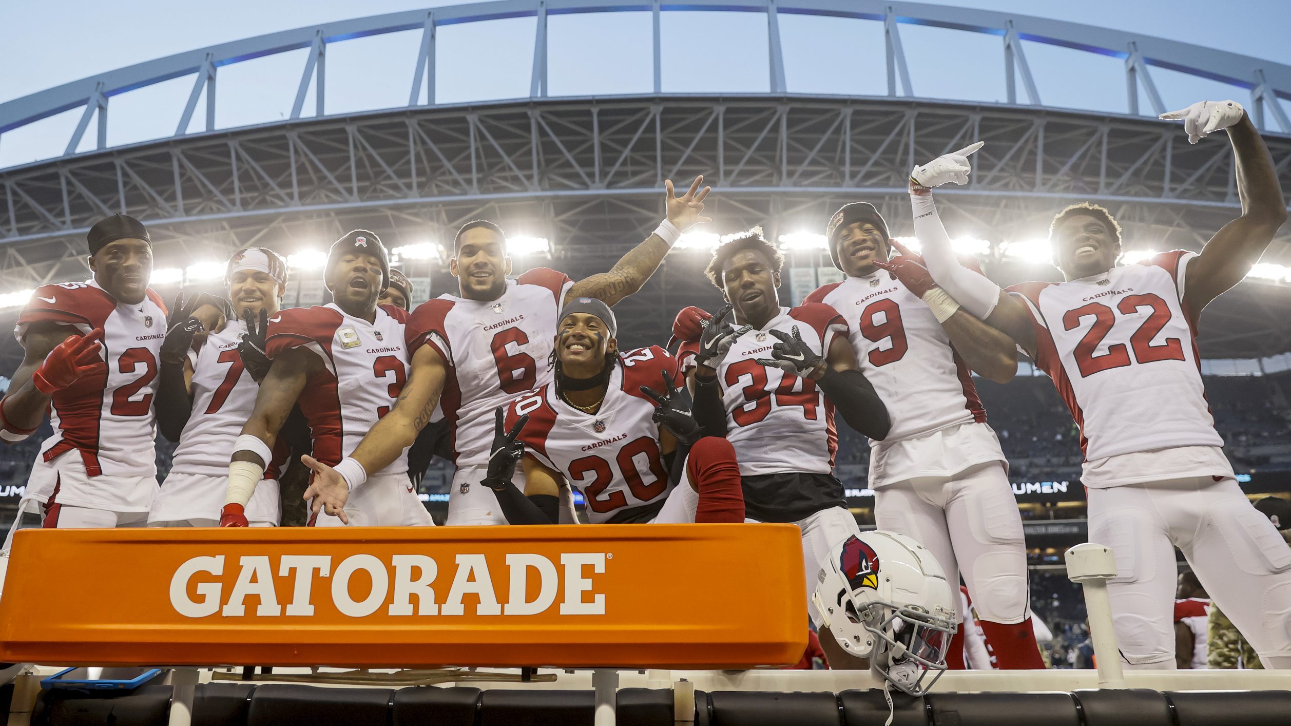 Arizona Cardinals players celebrate after defeating the Seattle Seahawks 23-13 at Lumen Field on No...