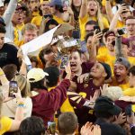 Defensive back Chase Lucas #24 of the Arizona State Sun Devils celebrates with the Territorial Cup after defeating the Arizona Wildcats at Sun Devil Stadium on November 27, 2021 in Tempe, Arizona. The Sun Devils defeated the Wildcats 38-15. (Photo by Christian Petersen/Getty Images)