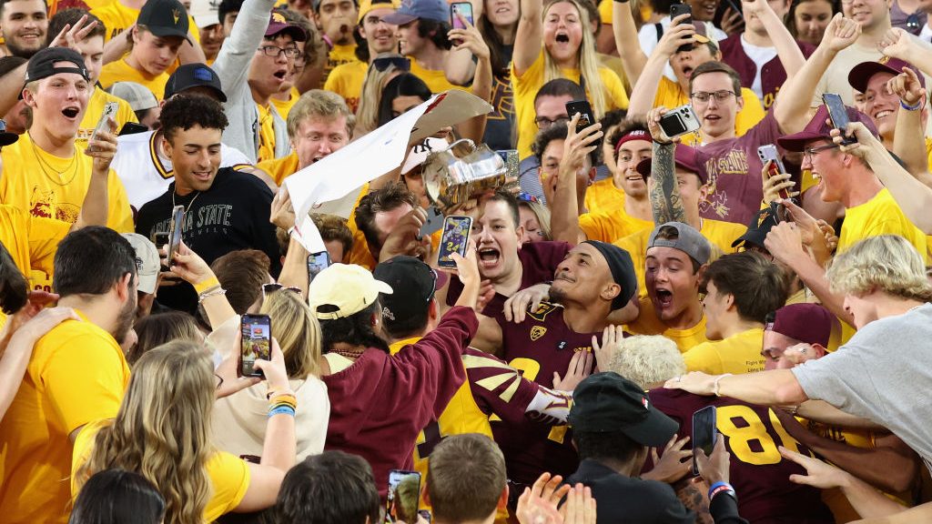 Defensive back Chase Lucas #24 of the Arizona State Sun Devils celebrates with the Territorial Cup ...
