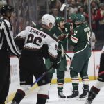 Minnesota Wild left wing Marcus Foligno (17) celebrates with left wing Jordan Greenway (18) after Greenway scored a goal against the Arizona Coyotes during the second period of an NHL hockey game Tuesday, Nov. 30, 2021, in St. Paul, Minn. (AP Photo/Stacy Bengs)