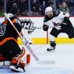 Arizona Coyotes' Phil Kessel, right, cannot get a shot past Philadelphia Flyers' Carter Hart during the first period of an NHL hockey game, Tuesday, Nov. 2, 2021, in Philadelphia. (AP Photo/Matt Slocum)