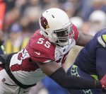 Seattle Seahawks quarterback Russell Wilson, right, is sacked by Arizona Cardinals' Chandler Jones during the second half of an NFL football game, Sunday, Nov. 21, 2021, in Seattle. (AP Photo/Ted S. Warren)