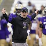 Washington acting coach Bob Gregory directs players before an NCAA college football game against Arizona State on Saturday, Nov. 13, 2021, in Seattle. (AP Photo/Elaine Thompson)