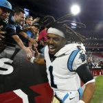 Carolina Panthers quarterback Cam Newton celebrates with Panthers fans after an NFL football game against the Arizona Cardinals Sunday, Nov. 14, 2021, in Glendale, Ariz. The Panthers defeated the Cardinals 34-10. (AP Photo/Ralph Freso)
