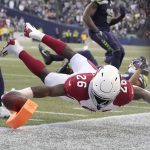Arizona Cardinals running back Eno Benjamin (26) dives for the end zone against the Seattle Seahawks during the second half of an NFL football game, Sunday, Nov. 21, 2021, in Seattle. Benjamin was ruled down earlier on the play. (AP Photo/Ted S. Warren)