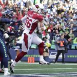 Arizona Cardinals tight end Zach Ertz (86) scores against the Seattle Seahawks during the first half of an NFL football game, Sunday, Nov. 21, 2021, in Seattle. (AP Photo/Ted S. Warren)