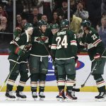 Minnesota Wild defenseman Jonas Brodin (25) celebrates with teammates on the ice after scoring a goal during the second period of an NHL hockey game against the Arizona Coyotes, Tuesday, Nov. 30, 2021, in St. Paul, Minn. Minnesota won 5-2. (AP Photo/Stacy Bengs)