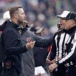 Arizona Cardinals head coach Kliff Kingsbury talks with officials during the first half of an NFL football game against the Seattle Seahawks, Sunday, Nov. 21, 2021, in Seattle. (AP Photo/John Froschauer)