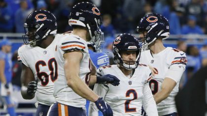 Chicago Bears kicker Cairo Santos (2) is surrounded by teammates after kicking the game winning fie...