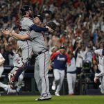 Atlanta Braves relief pitcher Will Smith and catcher Travis d'Arnaud celebrate after winning baseball's World Series in Game 6 against the Houston Astros Tuesday, Nov. 2, 2021, in Houston. The Braves won 7-0. (AP Photo/David J. Phillip)