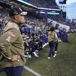 Seattle Seahawks defensive coordinator Ken Norton Jr., left, stands near the bench late in the second half of an NFL football game against the Arizona Cardinals, Sunday, Nov. 21, 2021, in Seattle. (AP Photo/Ted S. Warren)