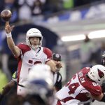 Arizona Cardinals quarterback Colt McCoy passes against the Seattle Seahawks during the second half of an NFL football game, Sunday, Nov. 21, 2021, in Seattle. (AP Photo/John Froschauer)