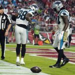 Carolina Panthers wide receiver Terrace Marshall Jr. (88) celebrates a touchdown against the Arizona Cardinals with Panthers tight end Ian Thomas (80) during the second half of an NFL football game Sunday, Nov. 14, 2021, in Glendale, Ariz. (AP Photo/Darryl Webb)
