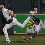 Houston Astros right fielder Kyle Tucker catches a fly ball by Atlanta Braves' Adam Duvall as center fielder Jose Siri falls during the eighth inning in Game 6 of baseball's World Series between the Houston Astros and the Atlanta Braves Tuesday, Nov. 2, 2021, in Houston. (AP Photo/Eric Gay)