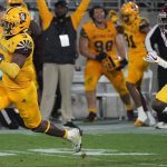 Arizona State running back Rachaad White (3) runs away from Southern California safety Calen Bullock (27) for a touchdown during the second half of an NCAA college football game Saturday, Nov. 6, 2021, in Tempe, Ariz. (AP Photo/Darryl Webb)