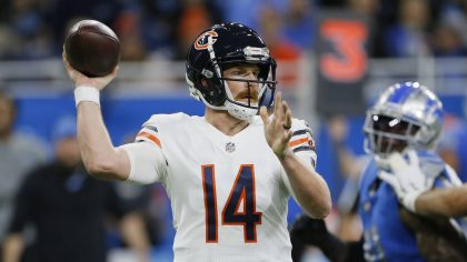 Chicago Bears quarterback Andy Dalton throws during the first half of an NFL football game against ...