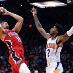 New Orleans Pelicans center Jaxson Hayes (10) shoots over Phoenix Suns guard Elfrid Payton (2) during the second half of an NBA basketball game Tuesday, Nov. 2, 2021, in Phoenix. The Suns won 112-100. (AP Photo/Ross D. Franklin)